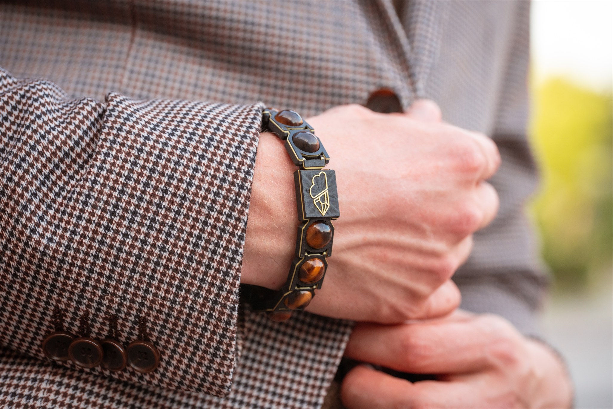 Tiger-eye Crystal Sky bracelet styled with a tailored jacket