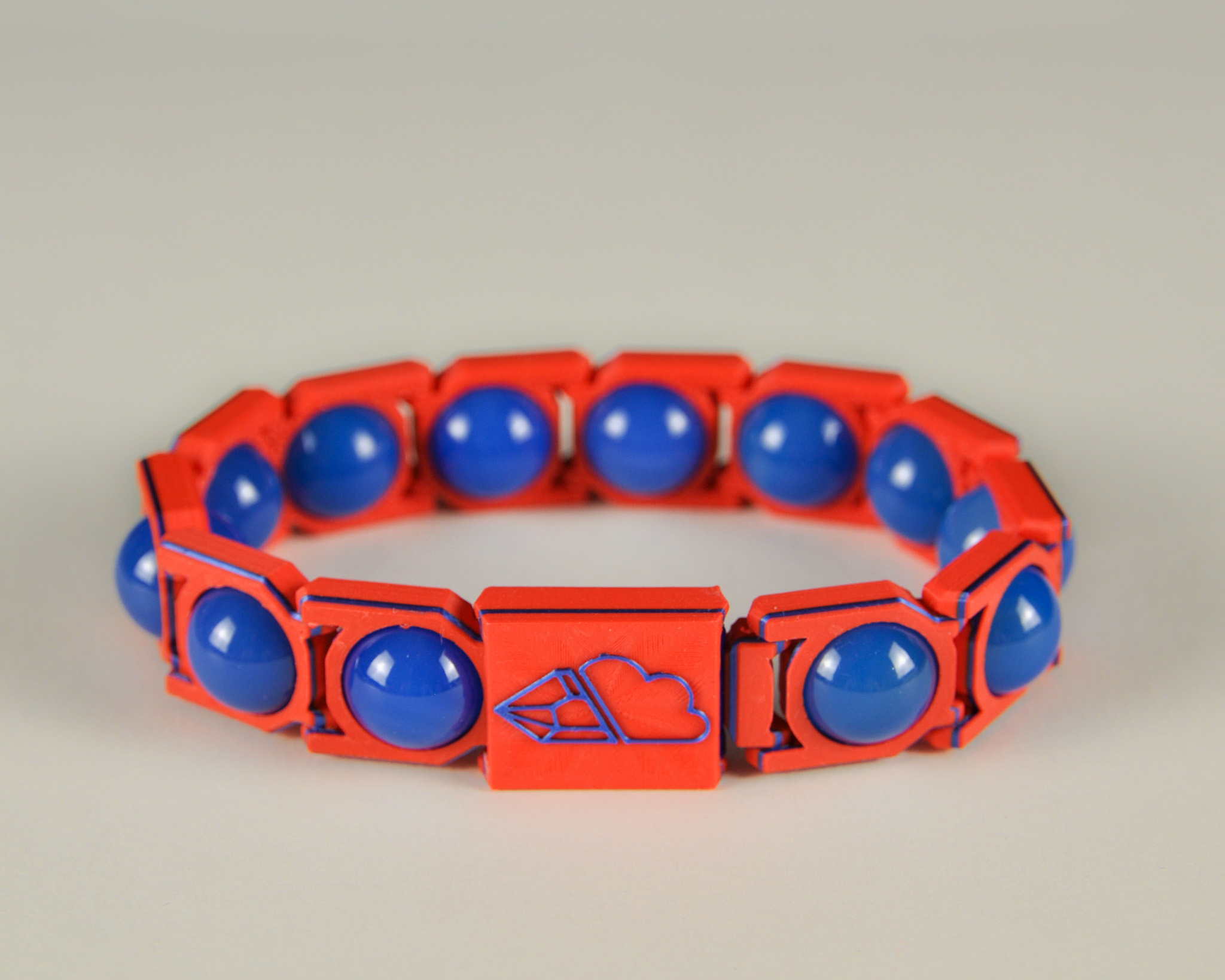 Blue agate sphere bracelet in blue and red, front view