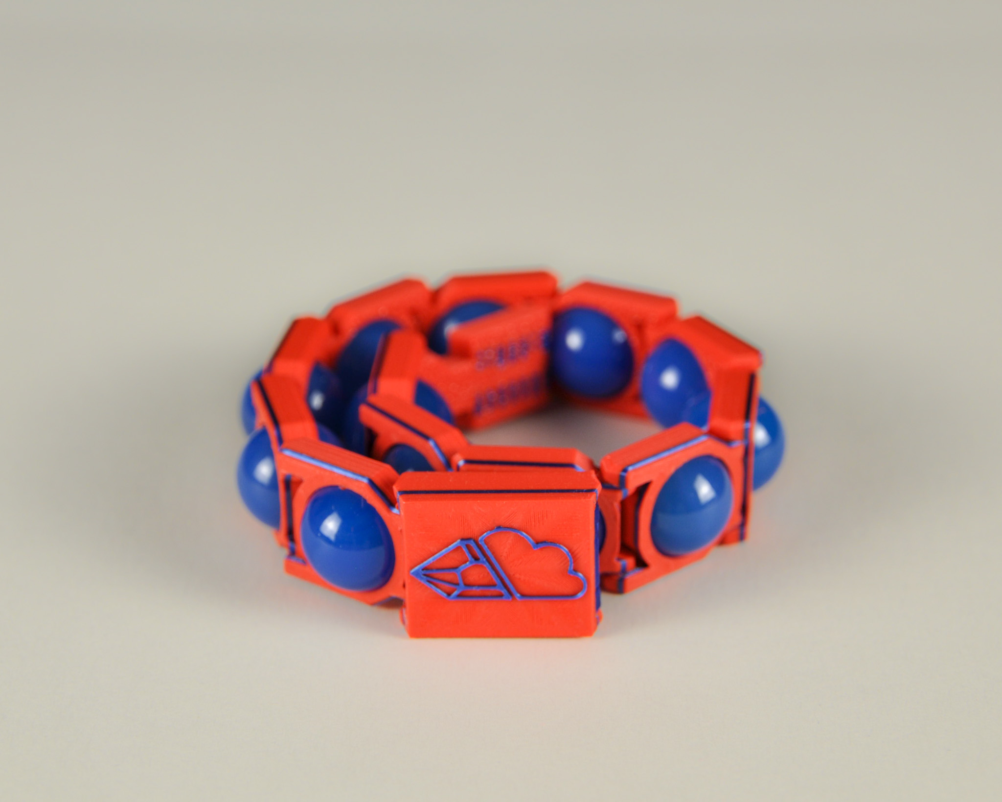 Blue agate bracelet in blue and red, angled view