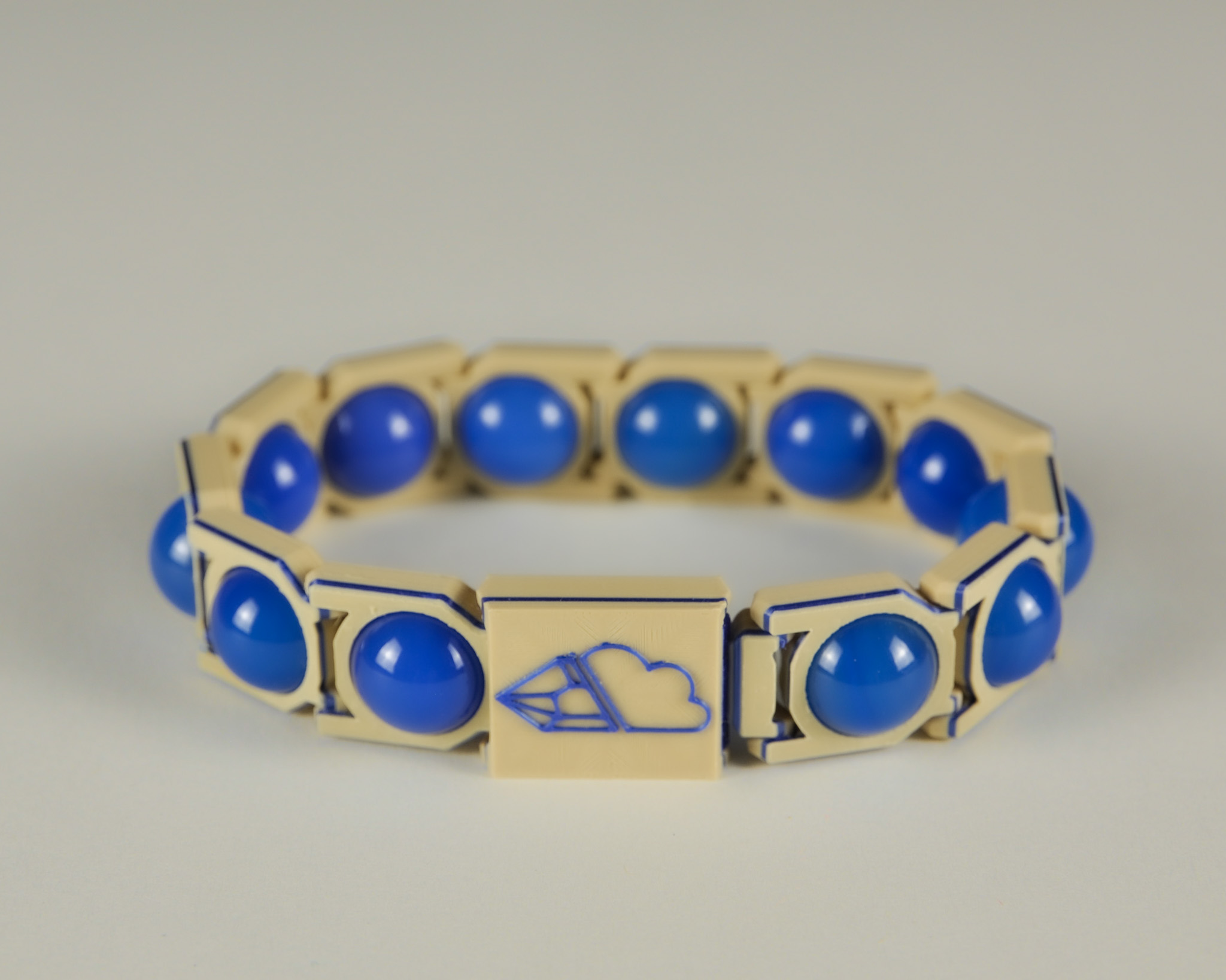 Blue agate sphere bracelet in blue and tan, front view
