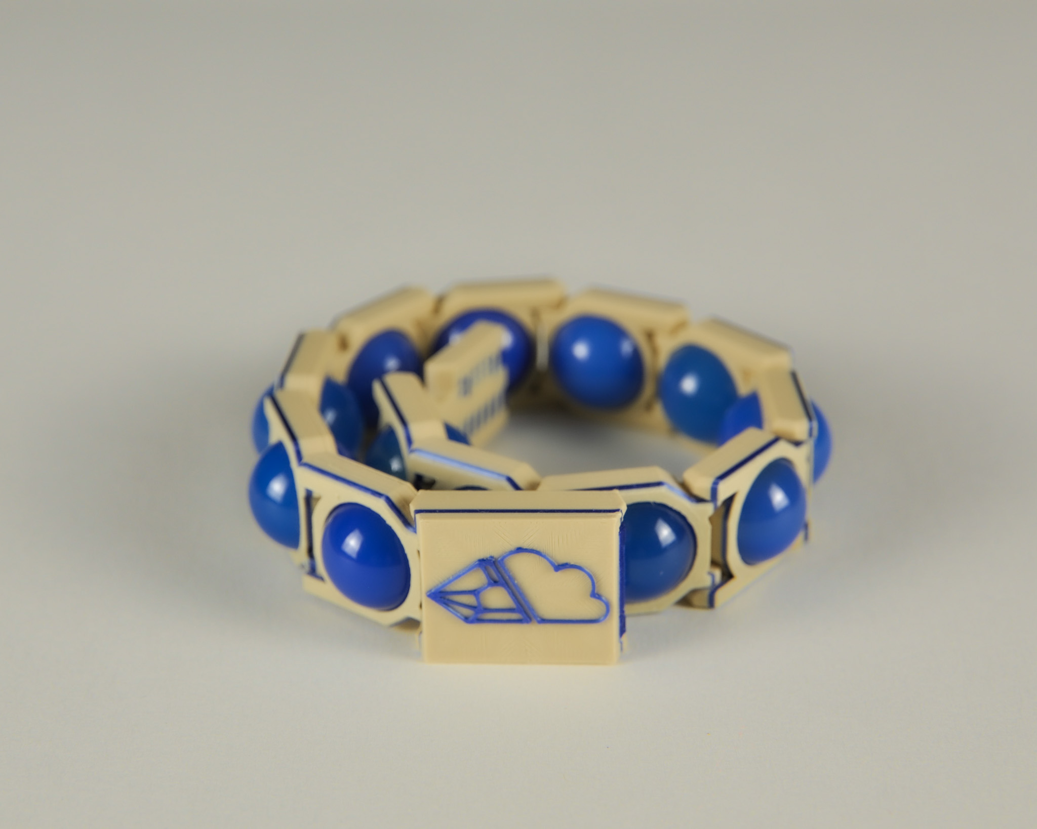 Blue agate bracelet in blue and tan, angled view