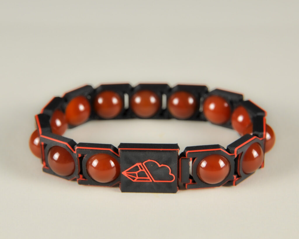 Red agate sphere bracelet in red and black, front view