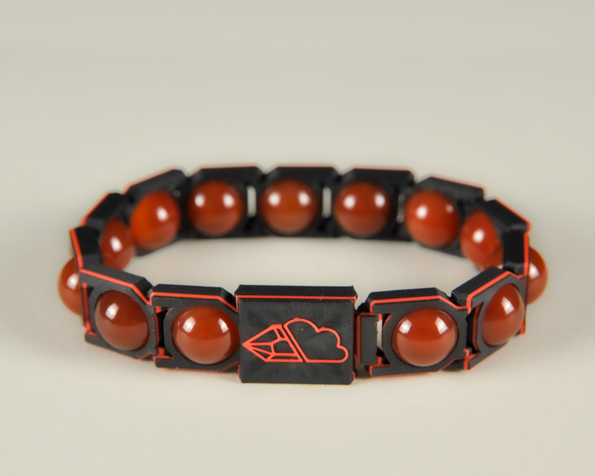 Red agate sphere bracelet in red and black, front view