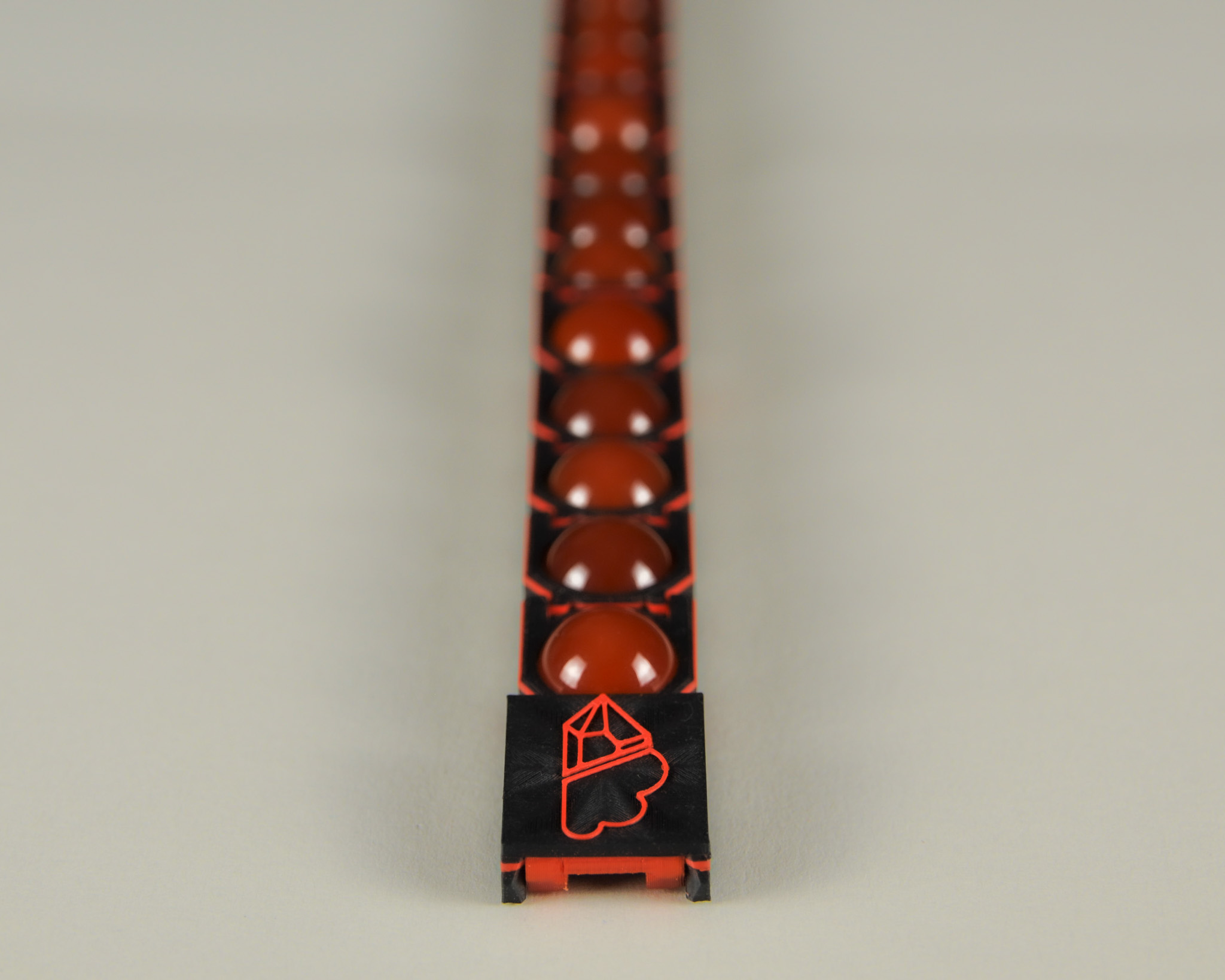 Red agate bracelet in red and black, straight layout
