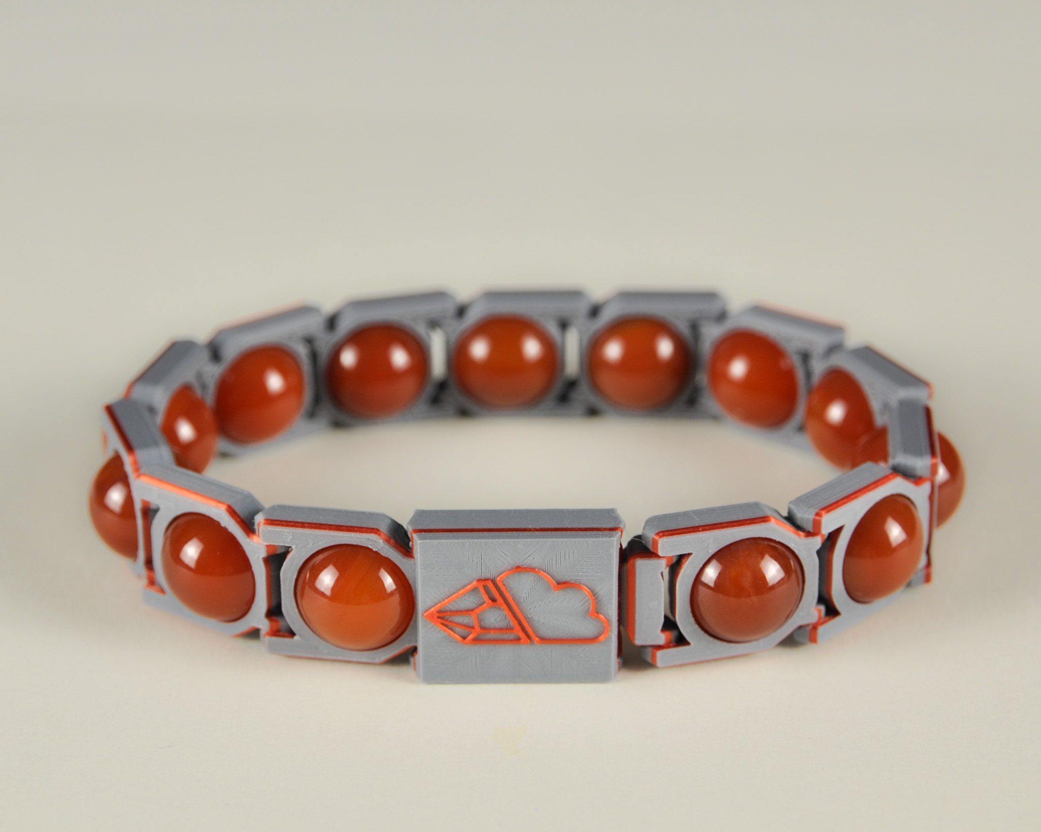 Red agate sphere bracelet in red and grey, front view