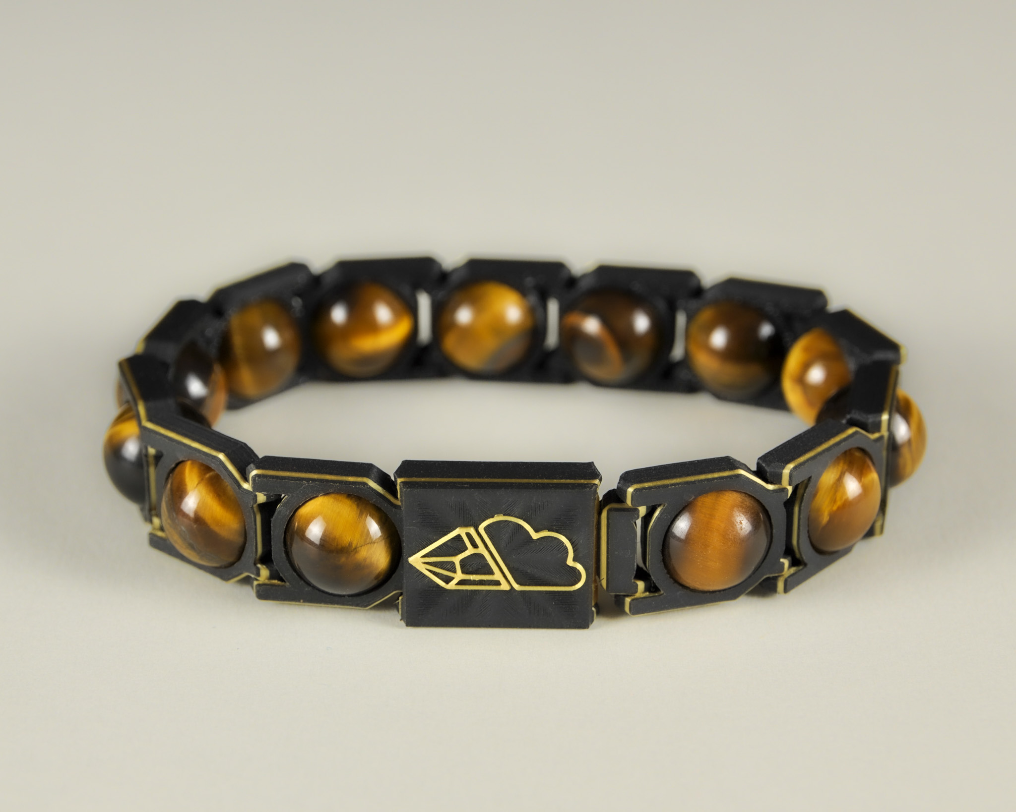 Tiger’s eye sphere bracelet in gold and black, front view