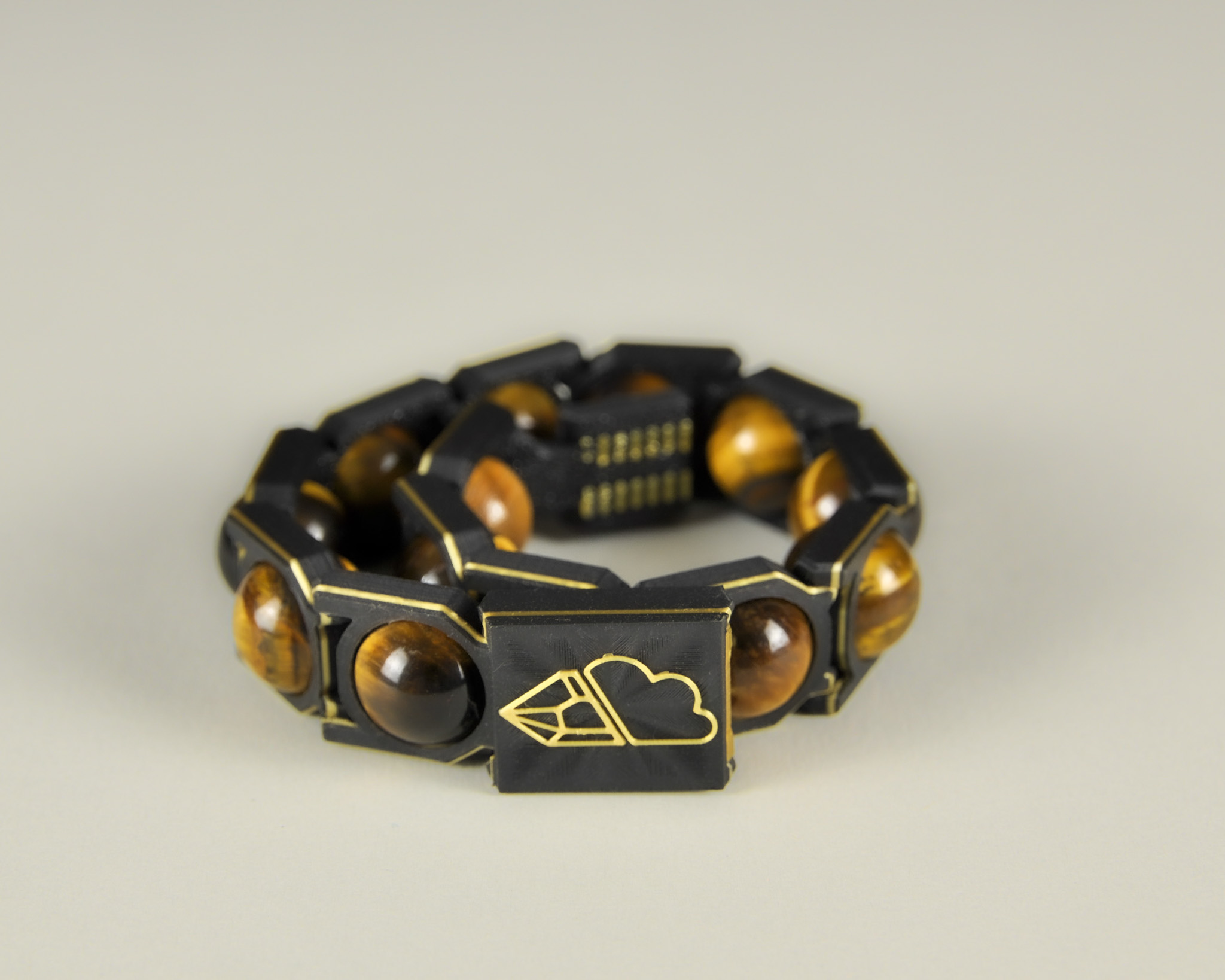 Tiger’s eye bracelet in gold and black, angled view