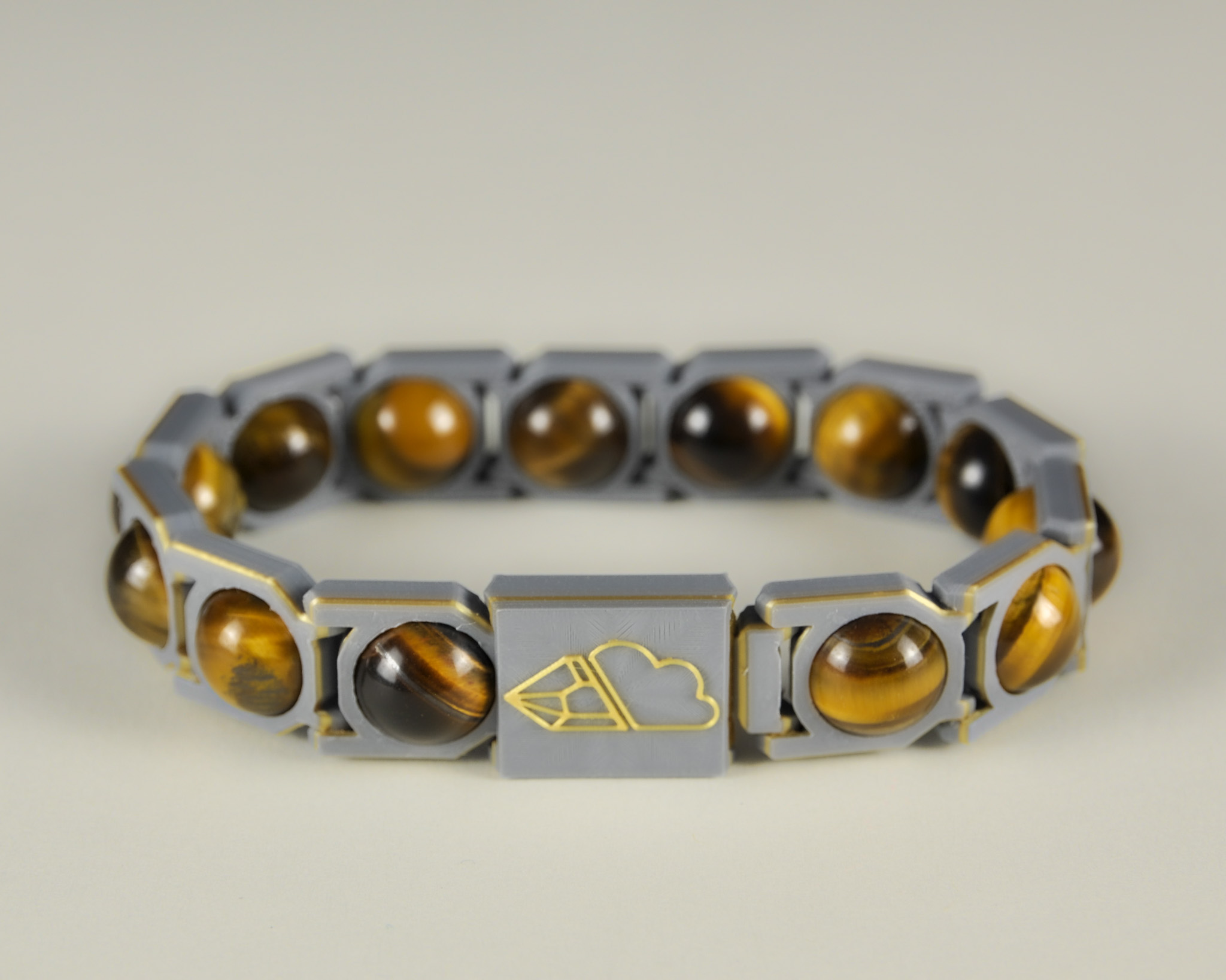 Tiger’s eye sphere bracelet in gold and grey, front view